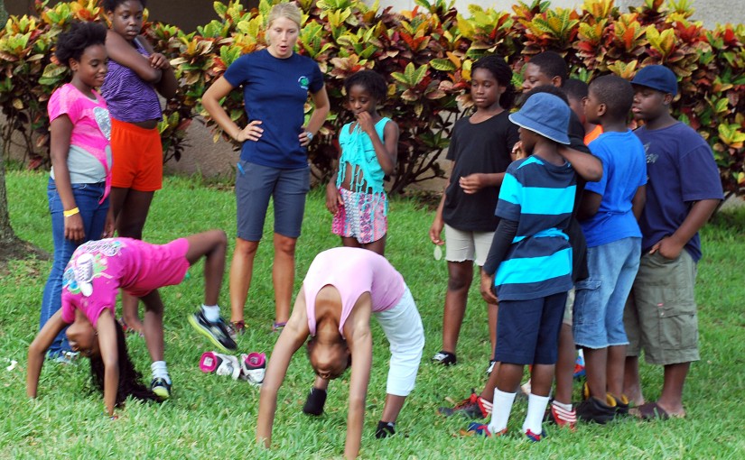 Some of the youngsters at the camp, shown here with camp leader Lindsey Hosier (in blue T-shirt), have never been to the beach or to downtown St. Petersburg.